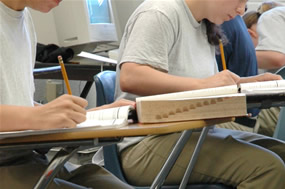 Girls sitting at desks in class.