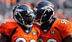 Elvis Dumervil (left) leads Denver's defensive charge. 