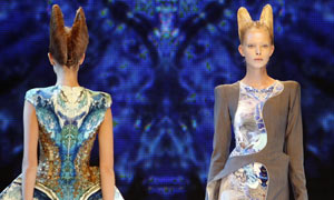 Models present creations by British designer Alexander McQueen