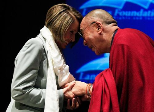 WASHINGTON - OCTOBER 06: The Dalai Lama (R) presents House Speaker Nancy Pelosi (D-CA) (L) with a Khata during a ceremony at the U.S. Capitol on October 6, 2009 in Washington, DC. The Lantos Foundation for Human Rights and Justice hosted the ceremony to honor the Dalai Lama as the first recipient of the Lantos Human Rights Prize.