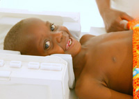  A child who has fully recovered from cerebral malaria demonstrates the MRI in Malawi.