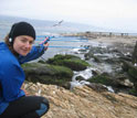 Photo of Jessica Meir scanning for the radio transmission of a seal that has returned from sea.