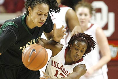 Oklahoma's Danielle Robinson (right) tries to push past Baylor's Brittney Griner, a 6-8 freshman.