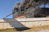 Smoke is seen from another angle of the building.