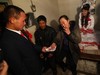 YUSHU, CHINA - DECEMBER 6:  Mother of the bride gives the groom Wang Yueming money after he called her mother during a wedding ceremony at the Wangjiacun Village on December 6, 2009 in Yushu of Jilin Province, China. The wedding of Nineteen-year-old Wang and eighteen-year-old Xiao Di, who...