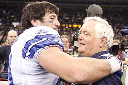 Keith Brooking (51) hugs head coach Wade Phillips after Saturday's win.