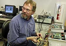  Senior systems engineer Kevin Amundsen, 52, of Farmersville, works on wiring for a sensor at a lab in the NTEC building in Frisco.