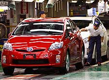 A worker performs the final inspection on a 2010 Prius at Toyota's Tsutsumi Plant in Toyota, Japan.