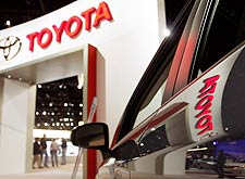 The Toyota name and logo are reflected in a Prius that was on display at the the Chicago Auto Show last week. 