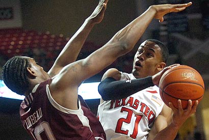 Texas A&M's David Loubeau (left) defends against Texas Tech's John Roberson.