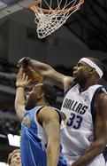 Dallas center Brendan Haywood (33) blocks the shot from New Orleans guard Marcus Thornton during the first quarter. Haywood had 9 rebounds and 2 blocks to go with 12 points.