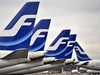 Passenger planes of the Finnish national airline company Finnair stand on the tarmac at Helsinki international airport, Helsinki, Finland Monday, Nov. 16, 2009. Finnair pilots have begun a strike that has grounded all scheduled international and domestic flights affecting thousands of passengers...