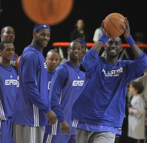 East All-Star Kevin Garnett tries a half-court shot into the basket during All-Star team practice at the NBA Fan Jam during NBA All-Star weekend at the Dallas Convention Cente