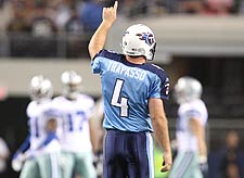 Titans punter A.J. Trapasso points up after bouncing a third-quarter punt off the bottom of the video board at Cowboys Stadium.