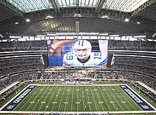 The gigantic video screens in Cowboys Stadium make the new facility impossible to ignore.