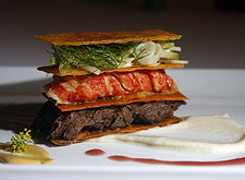  Butter poached lobster and short rib Napoleon with apple-fennel slaw, parsnip-yucca puree and smoked plum sauce