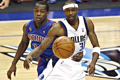 Dallas Mavericks guard Jason Terry (31) gets a pass off under pressure from Detroit Pistons guard Rodney Stuckey in Tuesday's game.