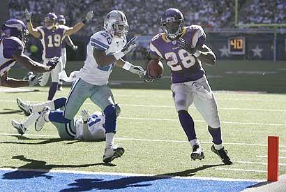 Adrian Peterson scores against Ken Hamlin and the Dallas Cowboys in their meeting in 2007.