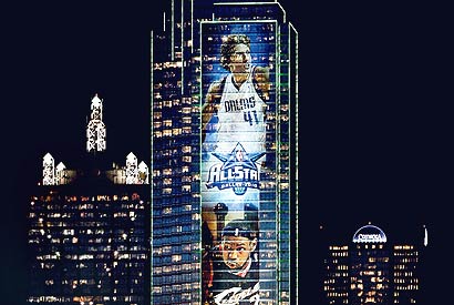 Dirk Nowitzki's image adorns a skyscraper lighting up the Dallas night as North Texas gets set to host the NBA's All-Star Weekend.