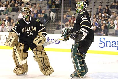 Stars goalie Marty Turco (left) is replaced by Kari Lehtonen in the second period.