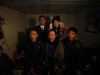 YUSHU, CHINA - DECEMBER 6:  Nineteen-year-old groom Wang Yueming and eighteen-year-old bride Xiao Di pose for pictures with families during their wedding ceremony at the Wangjiacun Village on December 6, 2009 in Yushu of Jilin Province, China. Wang and Xiao are farmers from the village. Usually...