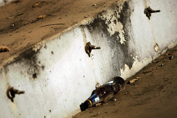 A leftover beer bottle remains from the last football game at the stadium on Dec. 20, 2008, against the Baltimore Ravens, the only NFL team that had not played previously at Texas Stadium.