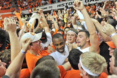 Oklahoma State's James Anderson celebrates with fans after the Cowboys knocked off No. 1 Kansas, 85-77.