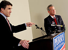 Texas Gov. Rick Perry (left) accepts the endorsement of Minuteman Project founder Jim Gilchrist Wednesday at the Crescent Hotel in Dallas.