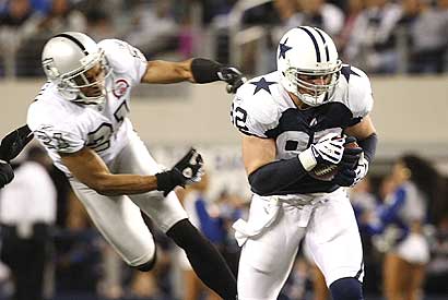 Jason Witten (right) is off and running for some of his 107 yards receiving.