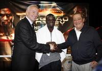 Professional boxer Joshua Clottey of Ghana (center) poses with Dallas Cowboys owner Jerry Jones (left) and boxing promoter Bob Arum after Clottey's workout at the Gaylord Texan, Monday, March 8, 2010.