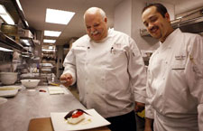 Ruben Toraño, (right), the executive pastry chef at Charlie Palmer at The Joule, has a moment with his father Rafael Toraño.