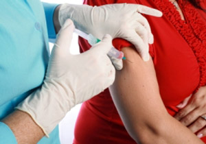 Vaccine being injected into persons arm