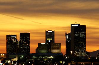 The Phoenix skyline is shown at sunset in this 2008 photo. The city's growth slowed dramatically during the past decade.