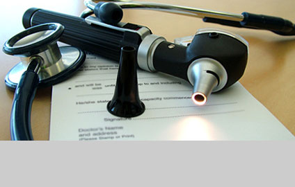 Photo of doctors tools on a table with a form