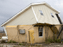 a house damaged by Hurricane Katrina