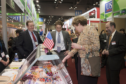 Ambassador Kathleen Stephens examines the wide range of cheeses being exhibited at Seoul Food and Hotel show with  Don Day-Gomes and Blair Tritt, International Sales Managers, for Schreiber Foods, Inc. of Green Bay, Wisconsin.