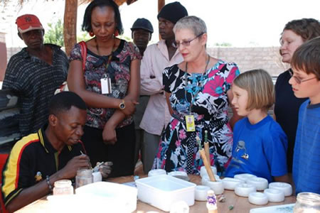 Collecting and delivering glass to make beads in Zambia, generating income for a community school for impoverished children.