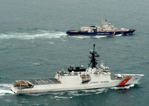 The crew of Coast Guard Cutter Bertholf and the Russian Federal Security Service frigate Vorovsky sail west for a joint effort April 21, 2011. The crews of the two ships are participating in a cultural exchange sharing training and best practices for several types of missions. U.S. Coast Guard photo by Petty Officer 1st Class Sara Francis.