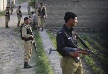 Army soldiers keep guard outside the compound where U.S. Navy SEAL commandos reportedly killed al Qaeda leader Osama bin Laden in Abbottabad on May 5, 2011. REUTERS/Faisal Mahmood 