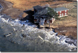 A home being destroyed by rising sea level