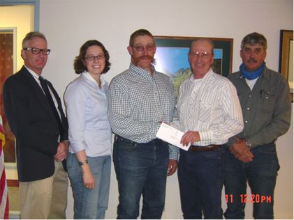 Bill Kimber of Grouse Creek, Utah is shown in this picture accepting a $1500 reward from Jim Connelley, Nevada State Brand Inspector and Meghan Wereley, Executive Director of Nevada Cattlemen’s Association and Andy Boyd representing Nevada Farm Bureau