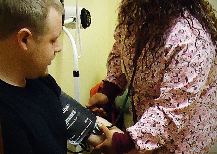 man having blood pressure taken