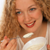 Photo of girl eating a bowl of yogurt