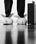 Businessman wearing bunny slippers (© Gary S. Chapman/Getty Images)