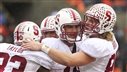 Image: Stanford's Luck celebrates a touchdown with teammates Taylor and Hewitt against Oregon State during their NCAA football game in Corvallis