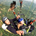 Scott Mason, left, pilots a paraglider over Pokhara, Nepal, with Anita Hjertas (Bob hitches a ride for a moment). Mr. Mason created the sport of parahawking, in which the paraglider follows a trained bird of prey to catch thermals.