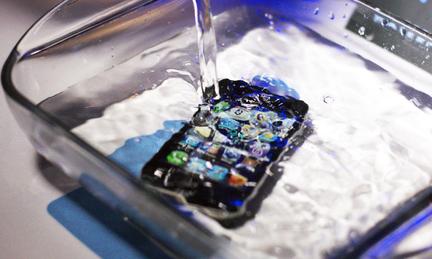 An iPhone submerged in water