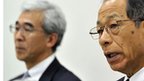 Former Olympus chairman Tsuyoshi Kikukawa (R) and vice president Hisashi Mori (L) at a press conference at the Tokyo Stock Exchange