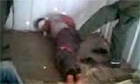 Amateur footage purports to show anti-Gaddafi fighters being tortured in Khoms