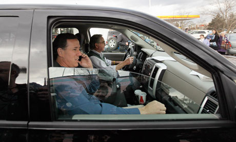 Rick Santorum is driven away from a campaign stop in Tilton, New Hampshire